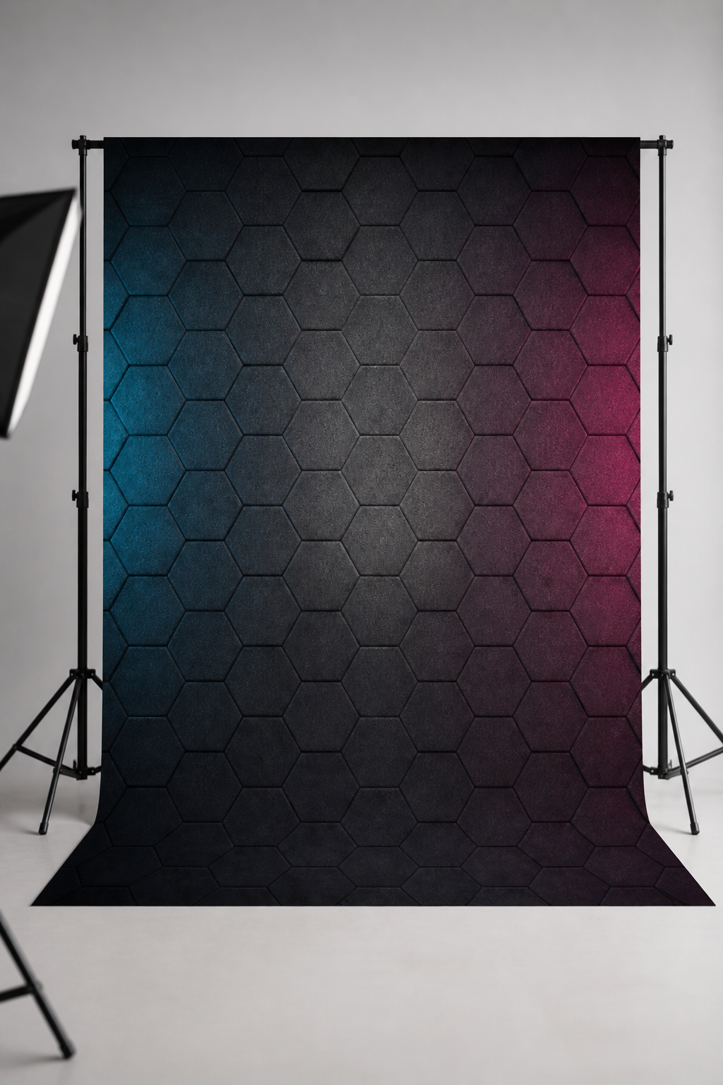 Ambient studio glow photography backdrop printed on matte microfiber, shown hanging on a backdrop stand in a studio