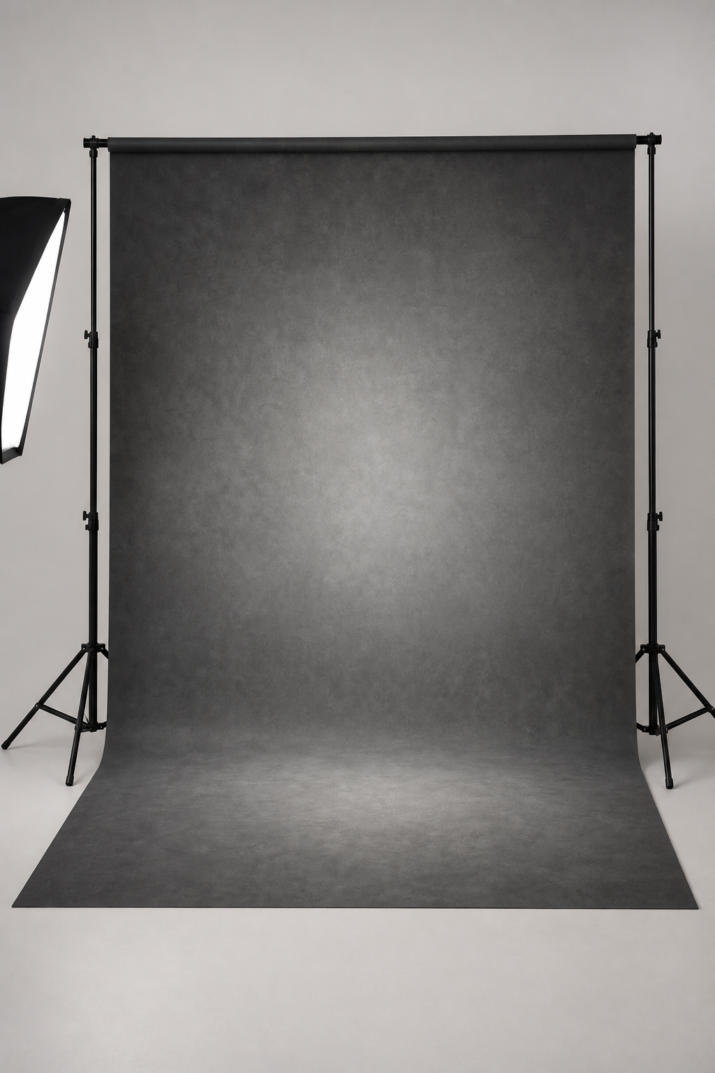 Executive charcoal sweep photography backdrop printed on matte microfiber, shown hanging on a backdrop stand in a studio