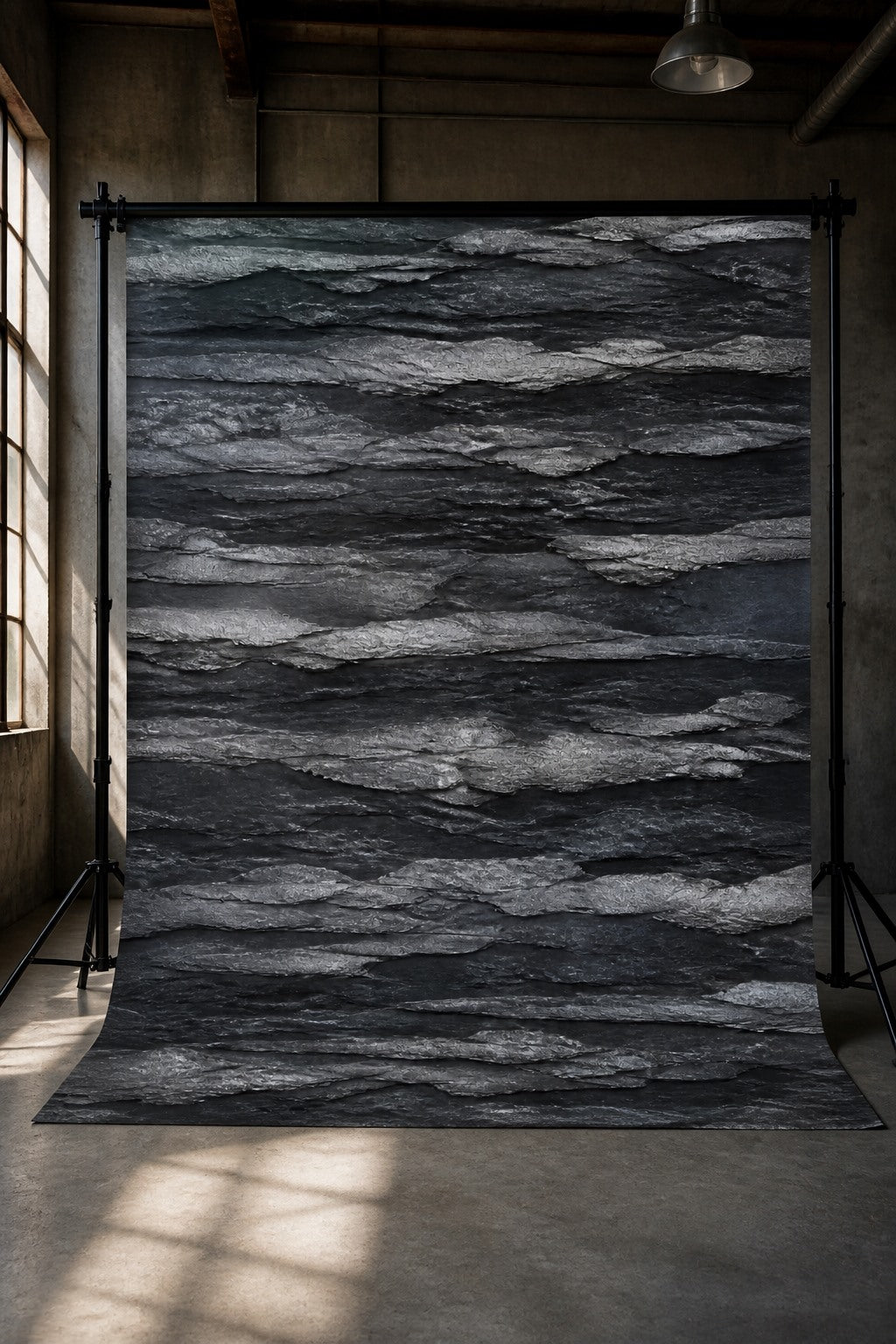 Charcoal Rock Strata photography backdrop displayed on a stand